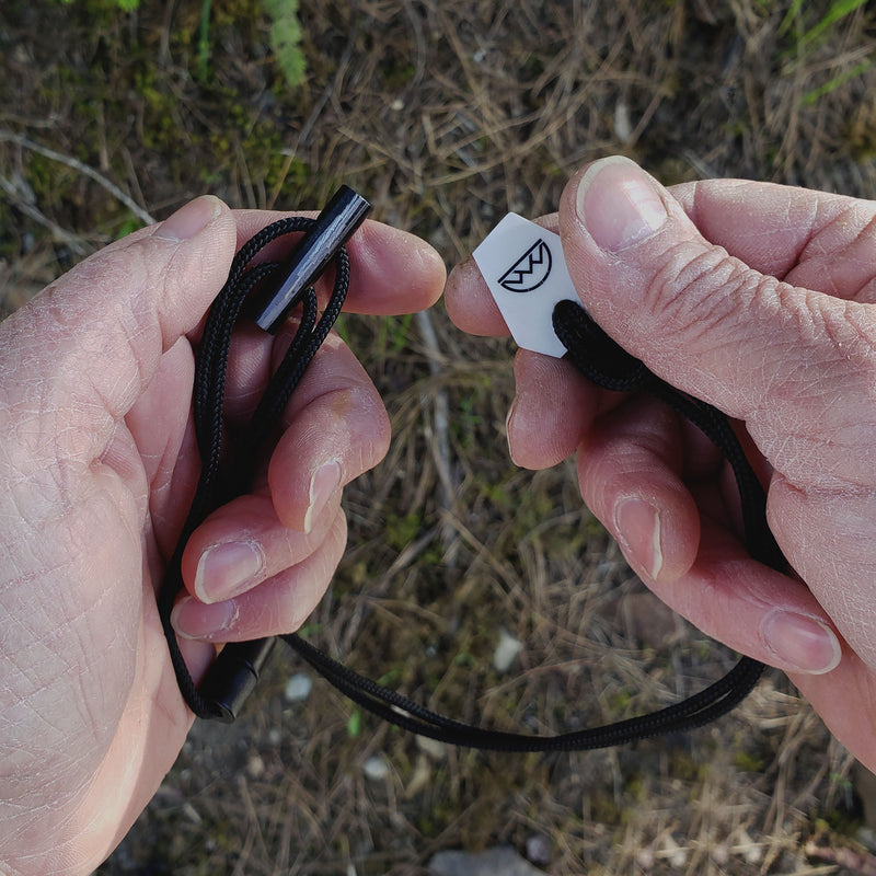 Load image into Gallery viewer, Emergency Fire Starter Necklace - Ultra Lightweight Mini Ferro Rod with Ceramic Striker &amp; Neck Lanyard
