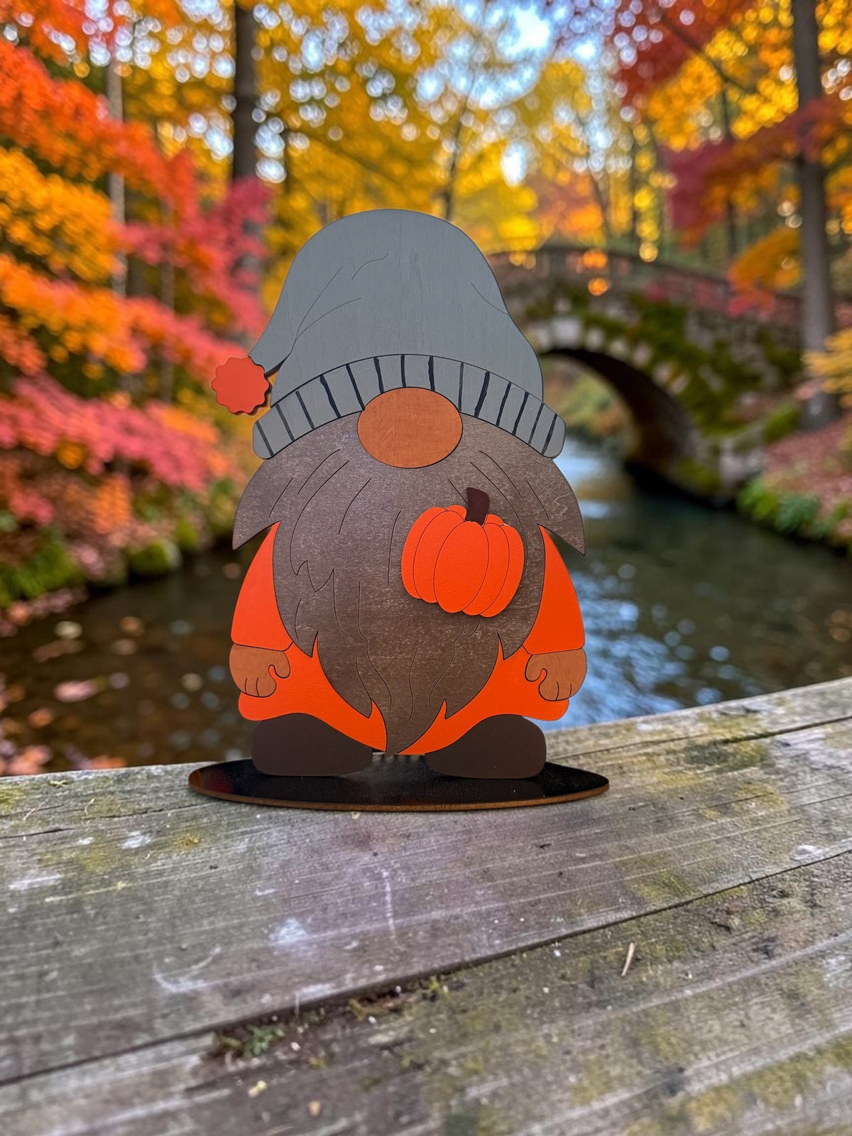 Painted wooden gnome with a pointed hat and beard, assembled from the Trail and Timber Co Fall Gnome DIY Kit