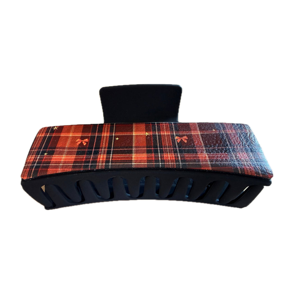 Side view of the fall plaid leatherette claw hair clip