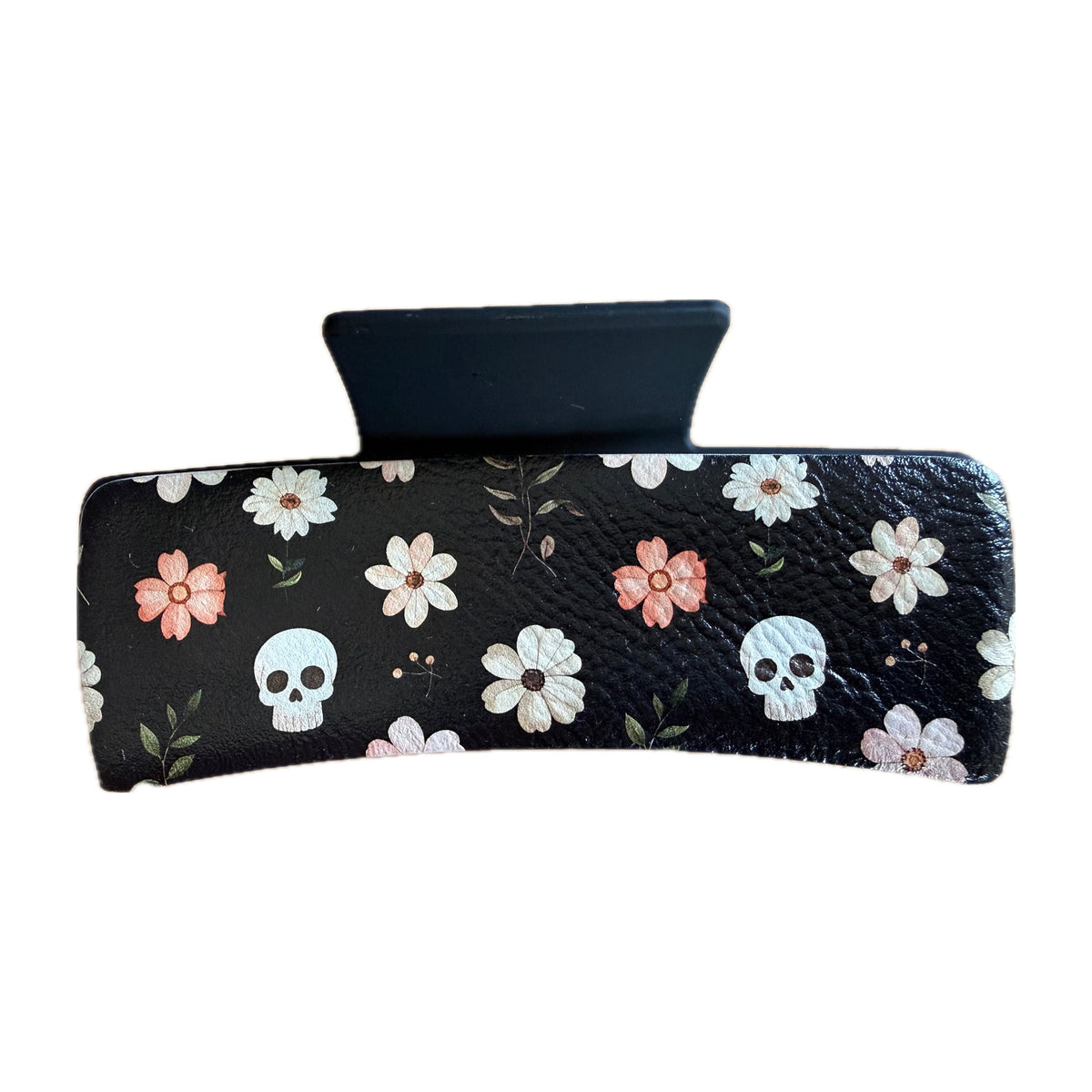 Black leatherette claw hair clip with white daisies and small skulls