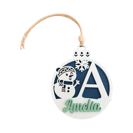 Trail and Timber Co custom wooden Christmas ornament featuring a snowman, snowflake, and letter A with name Amelia.
