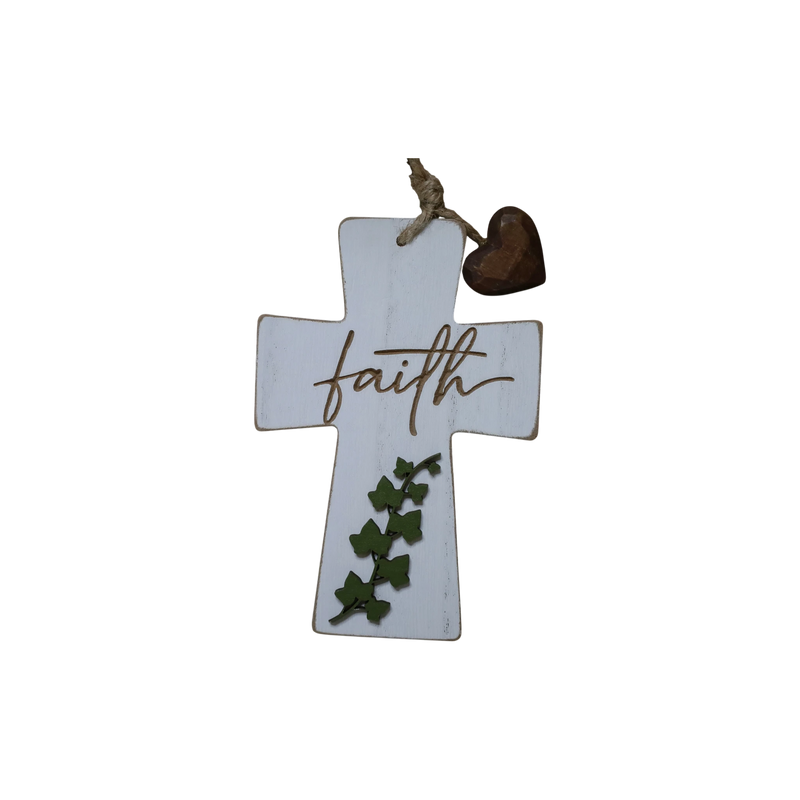 Load image into Gallery viewer, Trail and Timber Co white wooden cross ornament featuring the word faith, green ivy leaves, and a small brown heart.
