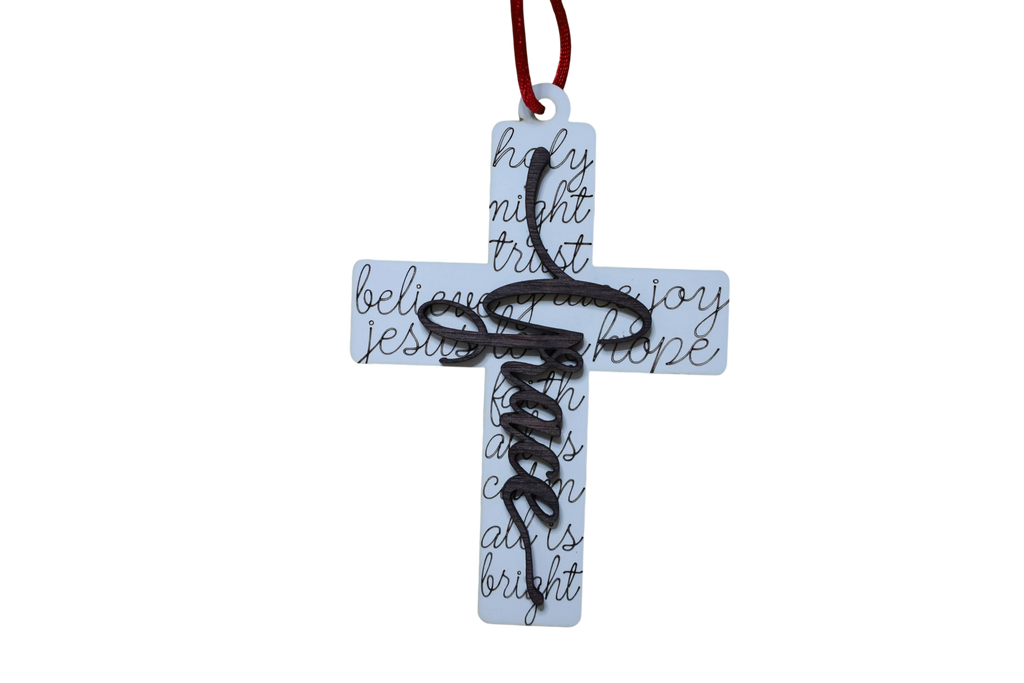Trail and Timber Co white wooden cross ornament featuring black script text and a red hanging ribbon