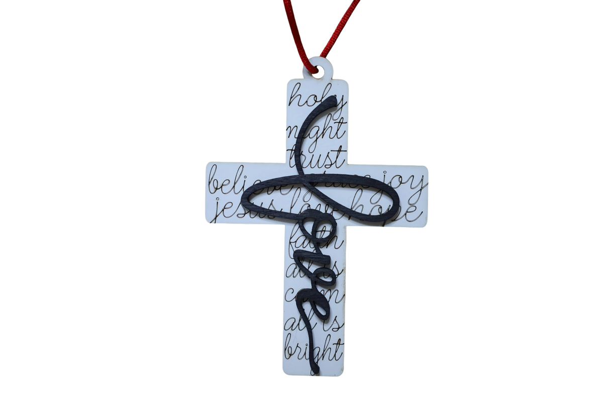 Trail and Timber Co white wooden cross ornament featuring black script text and a decorative black cursive love overlay