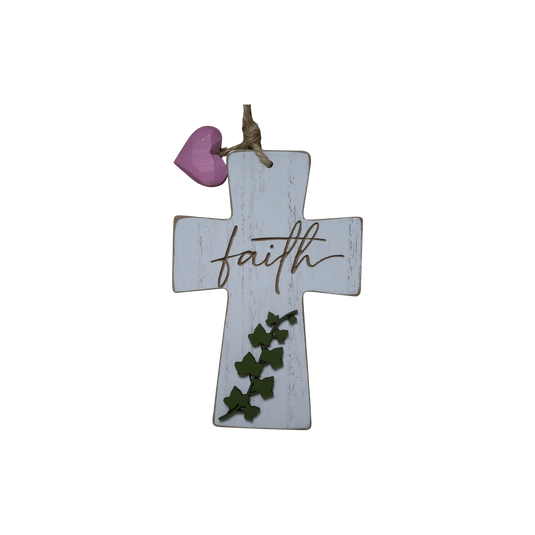 Trail and Timber Co white wooden cross ornament with faith script, green ivy leaves, and a small pink heart accent.